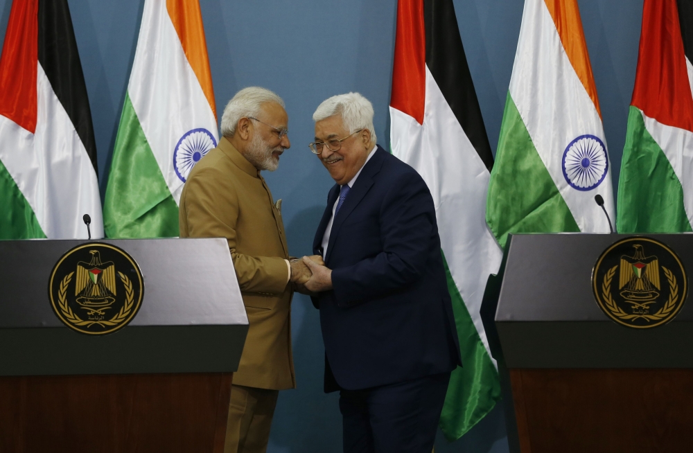 Palestinian president Mahmoud Abbas, right, shakes hands with Indian Prime Minister Narendra Modi during a joint press conference following their meeting in the West Bank city of Ramallah on Saturday. — AFP