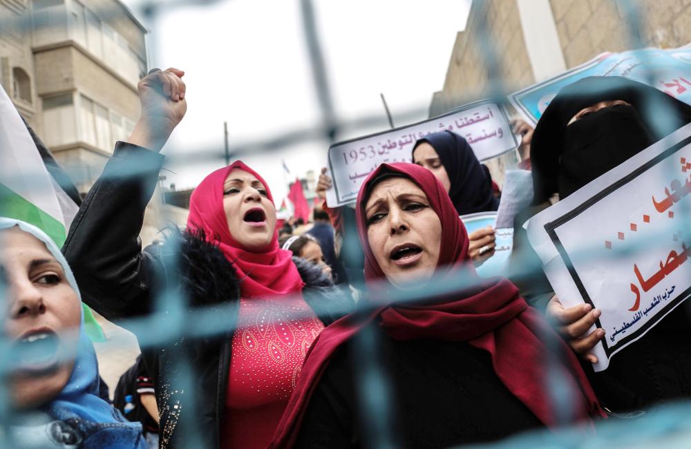 Palestinian women shout slogans during a protest against US aid cuts, outside the United Nations’ offices at the Khan Yunis refugee camp in the southern Gaza Strip. On January 16, Washington held back $65 million that had been earmarked for the UN Relief and Works Agency for Palestinian refugees (UNRWA), but the State Department denied the freeze was to punish the Palestinian leadership, which has cut ties with President Donald Trump’s administration following his recognition of Jerusalem as Israel’s capital last year, with a spokeswoman saying it was linked to necessary “reform” of UNRWA. — AFP