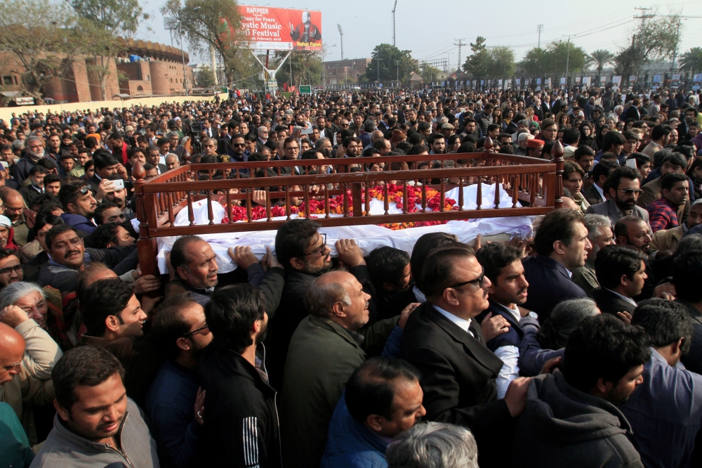 People carry the coffin of human rights campaigner Asma Jahangir, who died on Sunday, during her funeral in Lahore, Pakistan, on Tuesday. — Reuters