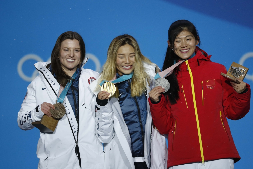 Gold medalist Chloe Kim of the US, silver medalist Liu Jiayu of China and bronze medalist Arielle Gold of the US on the podium after the Women's Halfpipe in Snowboarding at the Pyeongchang 2018 Winter Olympics on Tuesday. — Reuters