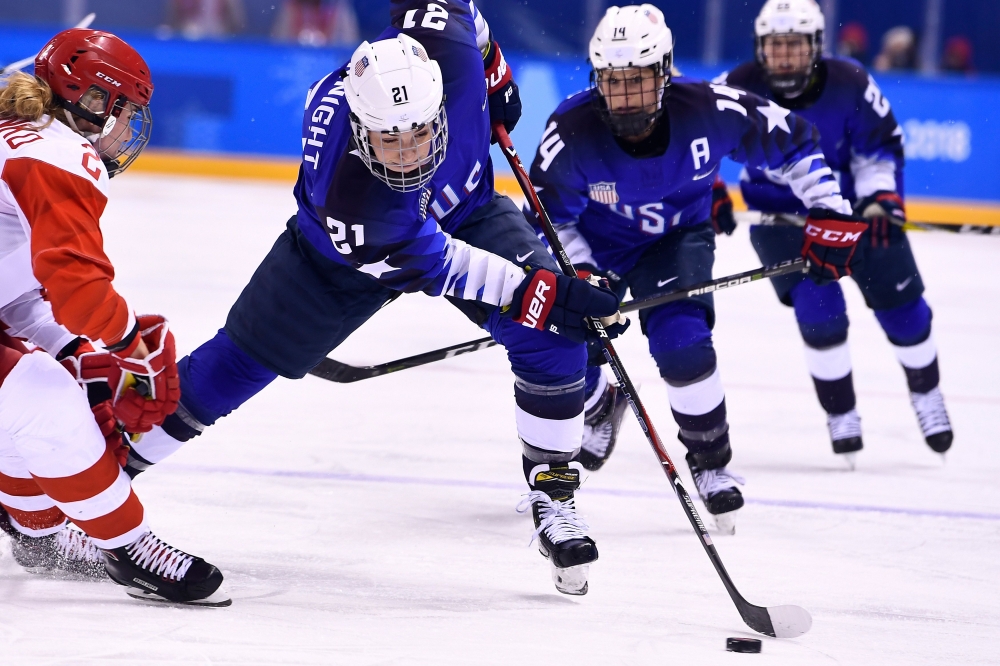 USA's Hilary Knight (2nd L) controls the puck in the women's preliminary round ice hockey match between the US and Olympic Athletes from Russia during the Pyeongchang 2018 Winter Olympic Games at the Kwandong Hockey Centre in Gangneung on Tuesday. — AFP