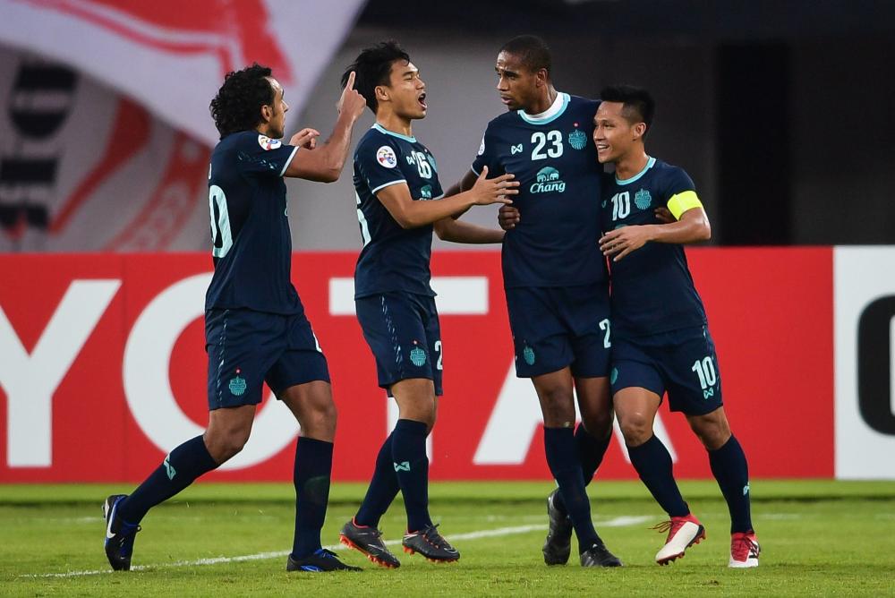 Buriram United players celebrate a goal during their AFC Champions League group stage football match against Guangzhou Evergrande in Guangzhou, China, Wednesday. — AFP