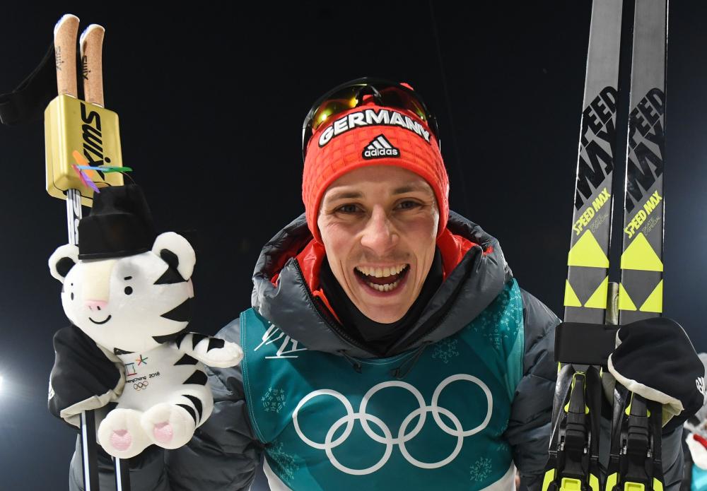 Germany’s Eric Frenzel celebrates winning gold during the victory ceremony following the nordic combined men’s individual normal hill NH/10km final at the Pyeongchang 2018 Winter Olympic Games Wednesday. — AFP