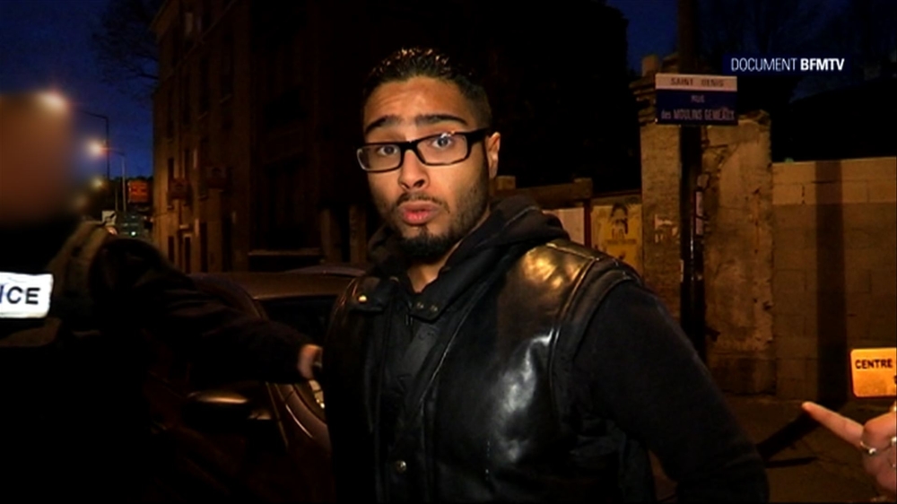 A file image grab made from a handout video taken on Nov. 18, 2015 and released on Nov. 25, 2015 by BFMTV shows Jawad Bendaoud, the man who allegedly lent his Paris suburb apartment to the suspected ringleader of the attacks on Paris, being arrested in Saint-Denis. — AFP
