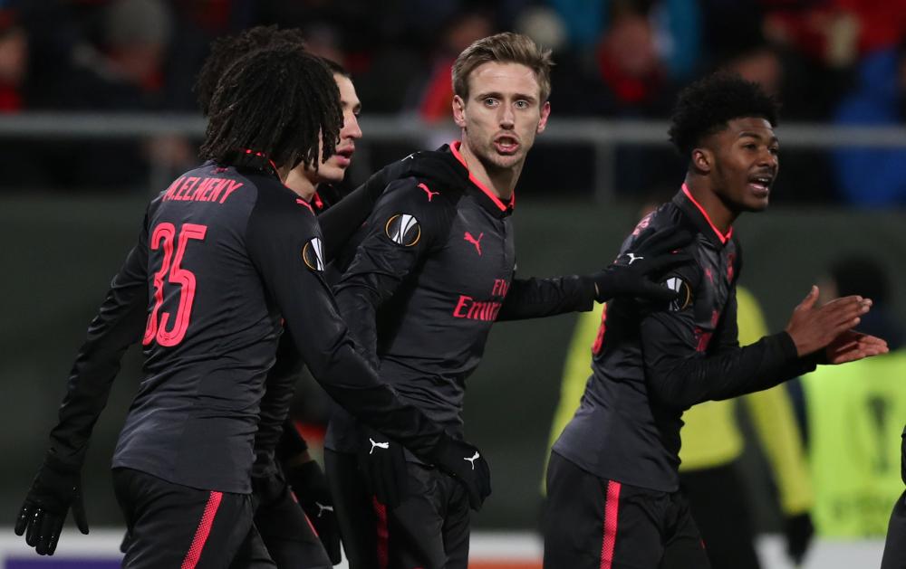Arsenal’s Nacho Monreal celebrates with teammates scoring their first goal against Ostersunds FK during the Europa League match in Ostersund, Sweden, Thursday — Reuters