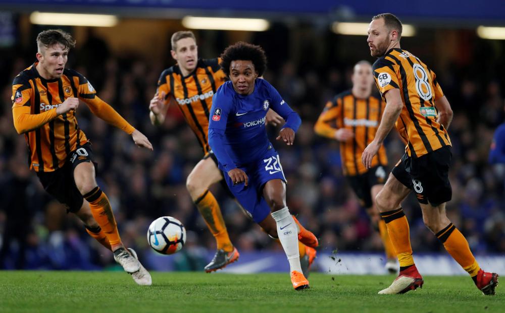Chelsea’s Willian (C) in action against Hull City during their FA Cup match at Stamford Bridge Friday. — Reuters