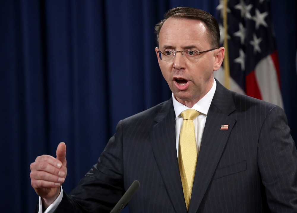 US Deputy Attorney General Rod Rosenstein announces the indictment of 13 Russian nationals and 3 Russian organizations for meddling in the 2016 U.S. presidential election at the Justice Department in Washington on Friday. — AFP
