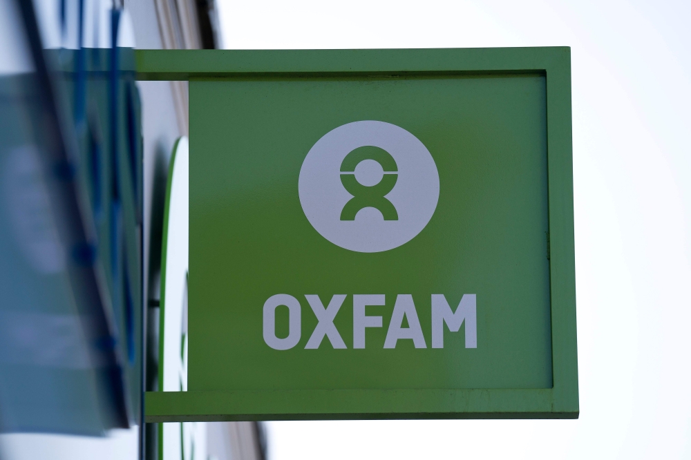‘Oxfam’ signage is pictured outside a high street branch of an Oxfam charity shop in south London on Feb. 17, 2018.  — AFP
