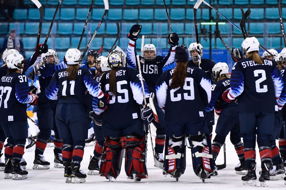 US players celebrate after the women's ice hockey semifinal game between the United States and Finland during the Pyeongchang 2018 Winter Olympic Games at the Gangneung Hockey Centre in Gangneung on Monday. — AFP