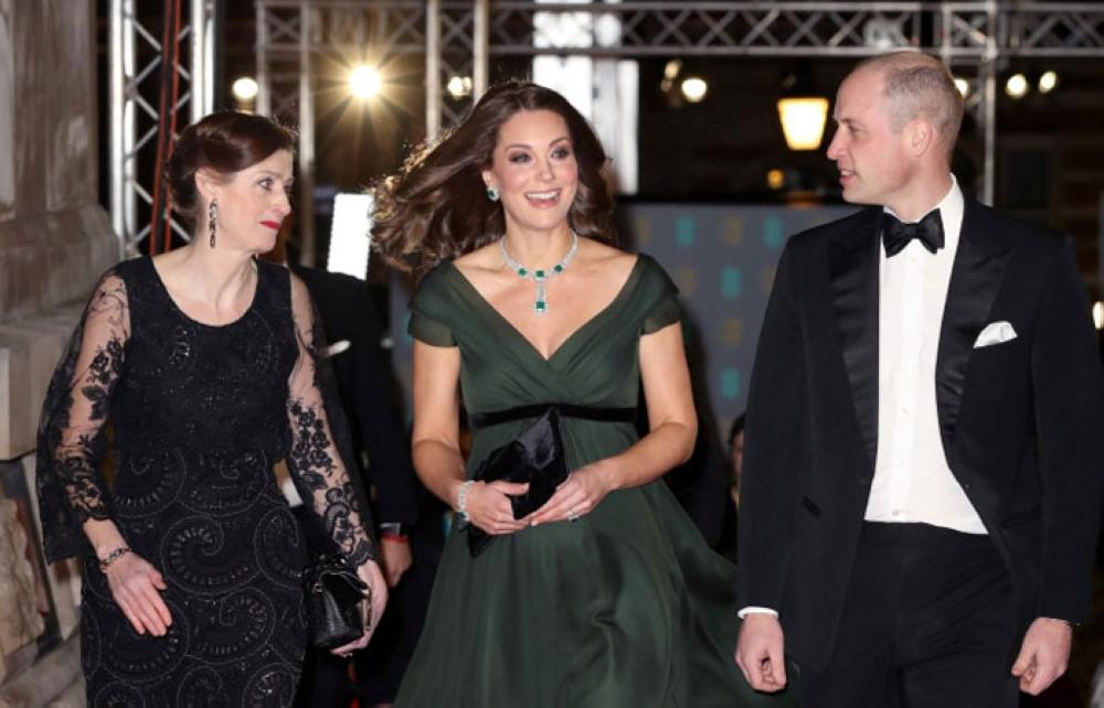 Chief Executive of BAFTA, Amanda Berry, left, greets Britain's Prince William, Duke of Cambridge and Britain's Catherine, Duchess of Cambridge as they attend the BAFTA British Academy Film Awards at the Royal Albert Hall in London on Monday. - AFP