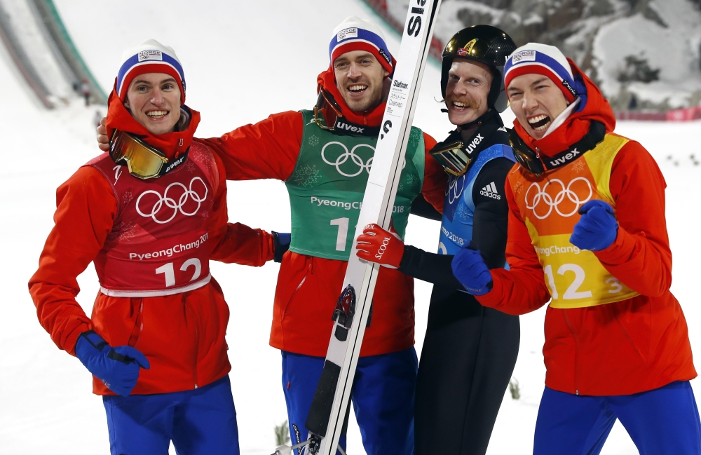 Daniel Andre Tande, Andreas Stjernen, Robert Johansson and Johann Andre Forfang of Norway celebrate their win in the Men's Ski Jumping Team Final at the Alpensia Ski Jumping Centre. — Reuters