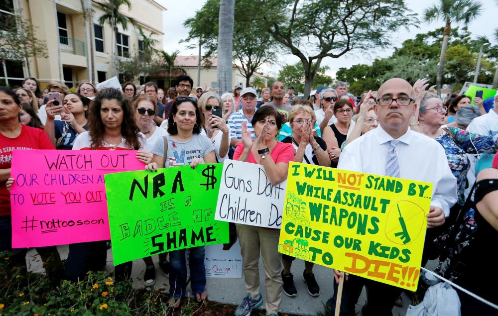 Protesters take part in a Call To Action Against Gun Violence rally by the Interfaith Justice League and others in Delray Beach, Florida, on Monday. — Reuters