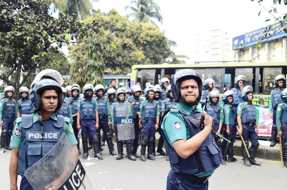 Bangladesh police stand guard as Bangladesh Nationalist Party (BNP) leaders and supporters attend a protest and hunger strike against the verdict in a corruption case against Bangladesh main opposition leader and BNP chairperson Khaleda Zia in Dhaka in this Feb. 14, 2018 file photo. — AFP
