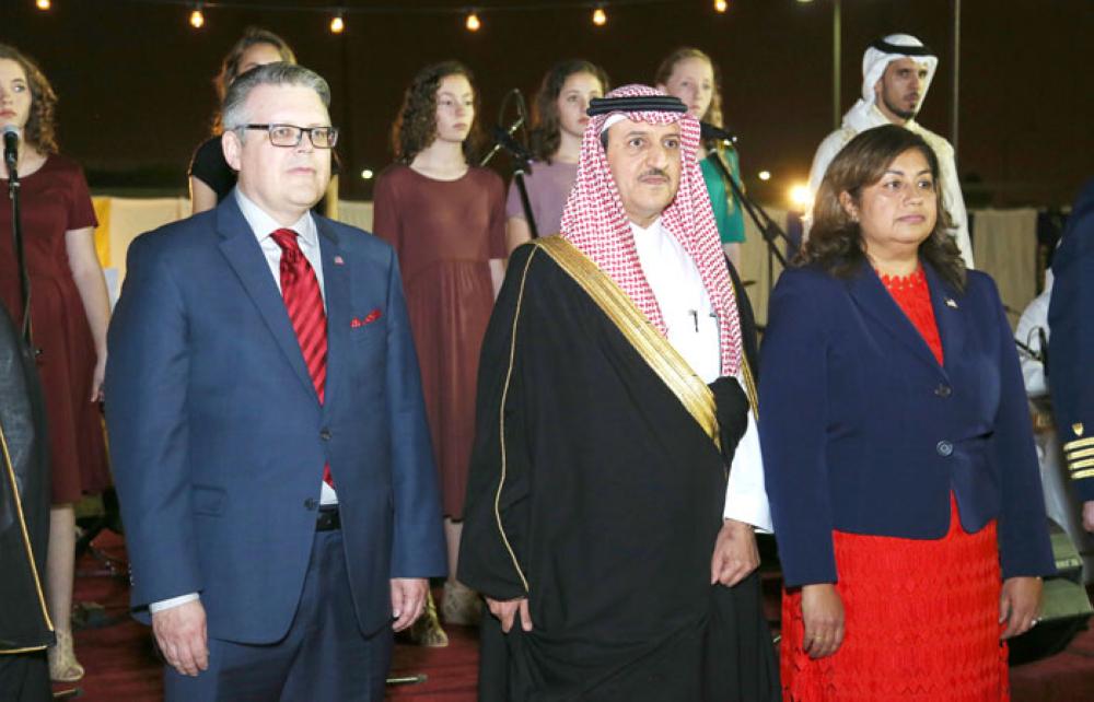 CG Korhonen, governor of Al-Khobar Suliman Al-Thunayan, and Juha Korhonen stand for the Saudi and US national anthems at the US National Day celebrations in Dhahran. — Courtesy photo
