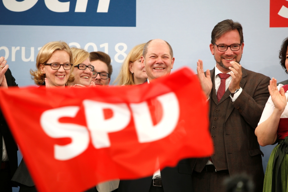 Olaf Scholz, second right, and Natascha Kohnen, left, attend the Social Democratic Party (SPD) traditional Ash Wednesday meeting in Vilshofen, Germany, in this Feb. 14, 2018 file photo. — Reuters