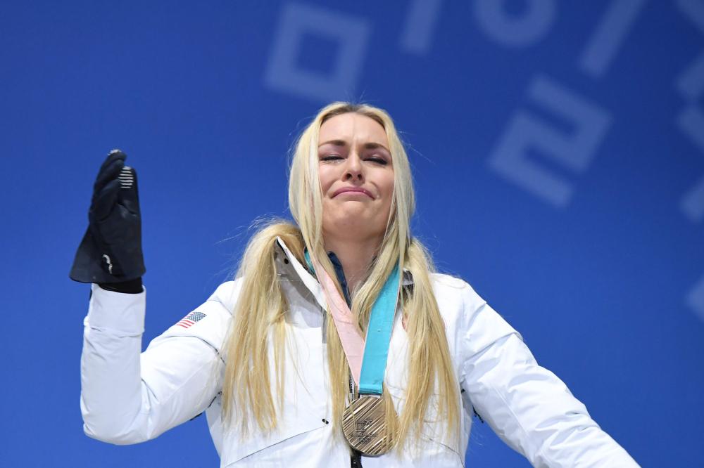 Bronze medalist Lindsey Vonn cries on the podium during the medal ceremony for the alpine skiing women’s downhill at the Pyeongchang 2018 Winter Olympic Games Wednesday. — AFP