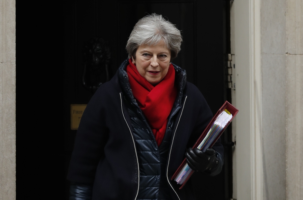 Britain’s Prime Minister Theresa May leaves 10 Downing street for the weekly Prime Minister Question (PMQ) session in the House of Commons in London on Wednesday. — AFP