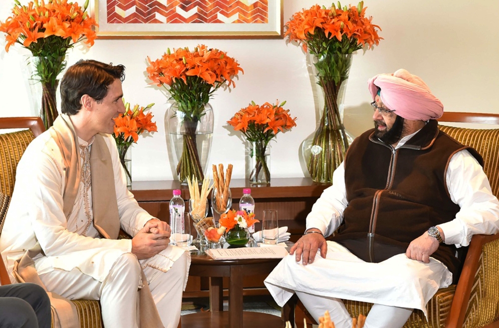 Canadian Prime Minister Justin Trudeau, left, meets with Punjab Chief Minister Amarinder Singh in Amritsar on Wednesday. — AFP