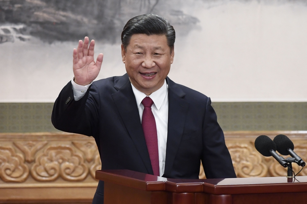 Chinese President Xi Jinping waves at the Great Hall of the People in Beijing in this Oct. 25, 2017 file photo. — AFP