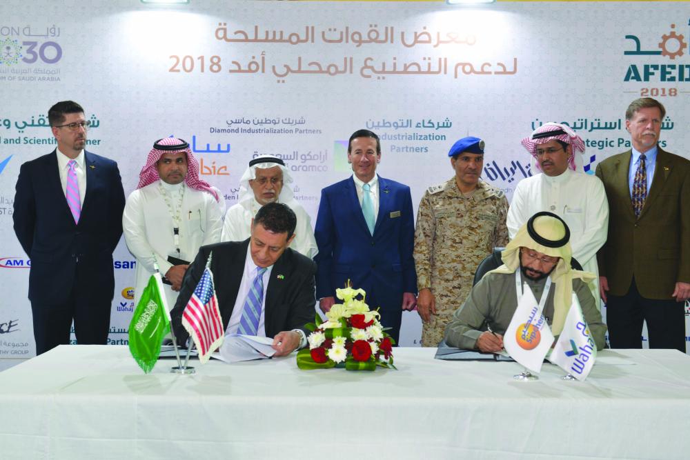 Officials of the signatory companies pose for a group photo