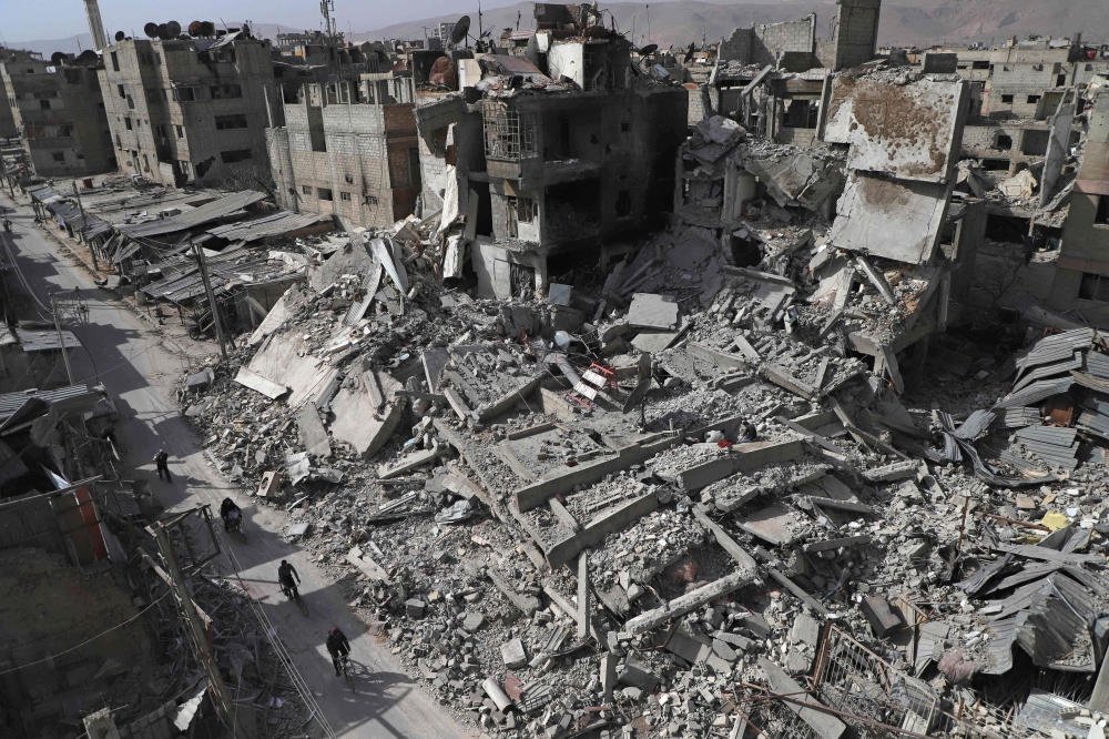 A general view shows several destroyed buildings in Douma, in the rebel enclave of Eastern Ghouta on the outskirts of Damascus. — AFP