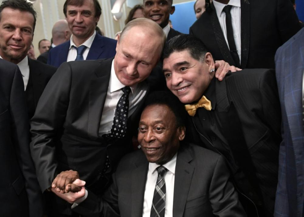 Russian President Vladimir Putin, Brazilian football legend Pele and Argentina's former midfielder Diego Maradona pose for pictures ahead of the Final Draw for the 2018 FIFA World Cup football tournament at the State Kremlin Palace in Moscow on Dec. 1, 2017. — AFP