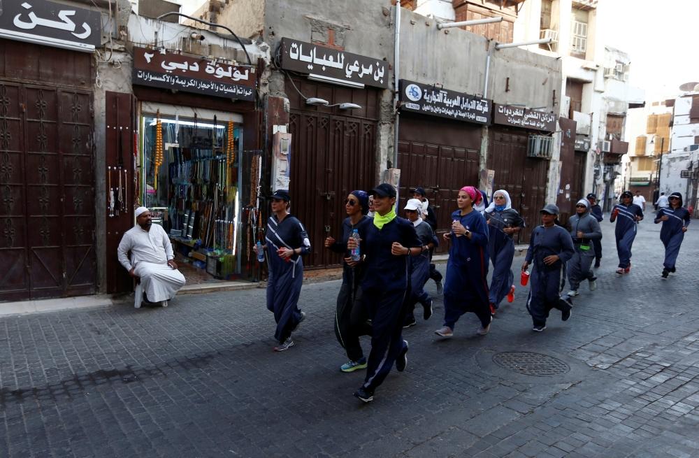 Women cheer during a running event marking International Women's Day in Old Jeddah, Saudi Arabia March 8, 2018. — Reuters