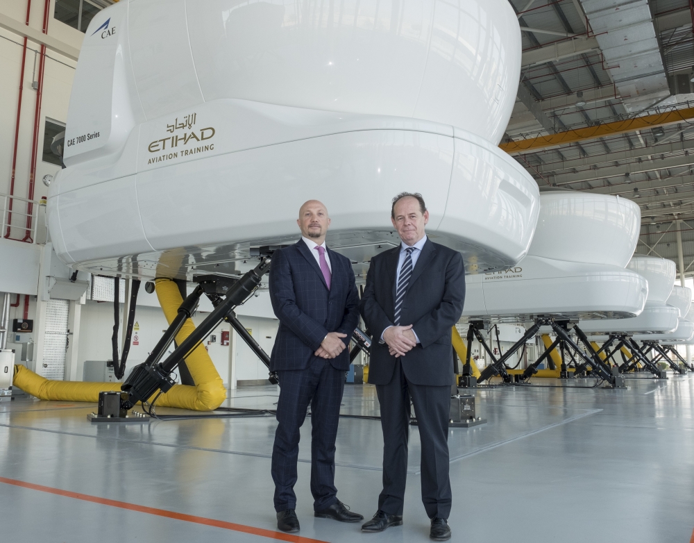 Capt. Paolo La Cava, director Etihad Aviation Training (left) with Chris Youlten, managing director Etihad Airport Services (right) at Etihad Aviation Training in Abu Dhabi. — Courtesy photo