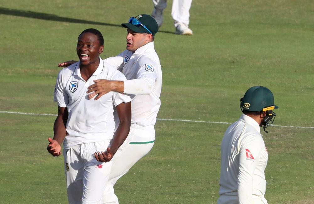 South Africa’s Kagiso Rabada celebrates after taking the wicket of Australia's Usman Khawaja during the second cricket Test match at St George's Park, Port Elizabeth, Sunday. — Reuters