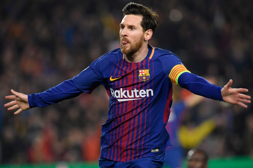 Barcelona's Argentinian forward Lionel Messi celebrates scoring his team's third goal during the UEFA Champions League round of sixteen second leg football match between FC Barcelona and Chelsea FC at the Camp Nou stadium in Barcelona on Wednesday. — AFP