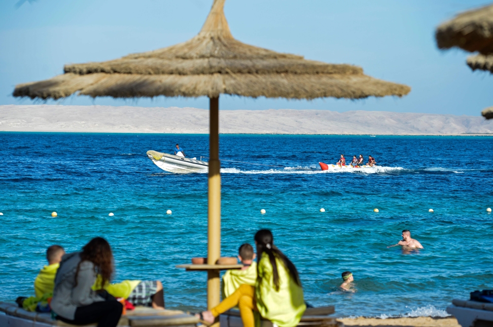 Tourists spend time at the beach in Egypt’s Red Sea resort of Hurghada in this Feb.18, 2018 file photo. — AFP