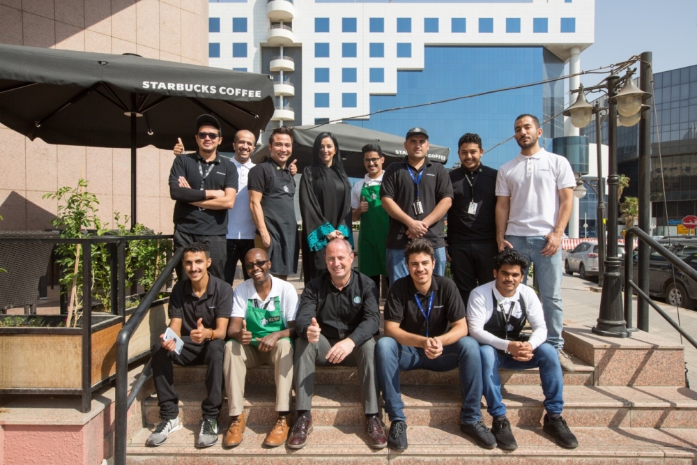 Group photo of Saudi youth working in the service sector. — Courtesy photo