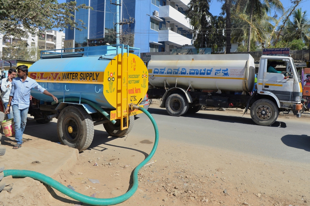Tankers deliver water to apartments in Bangalore, India, in this Feb.27, 2018 file photo. — AFP