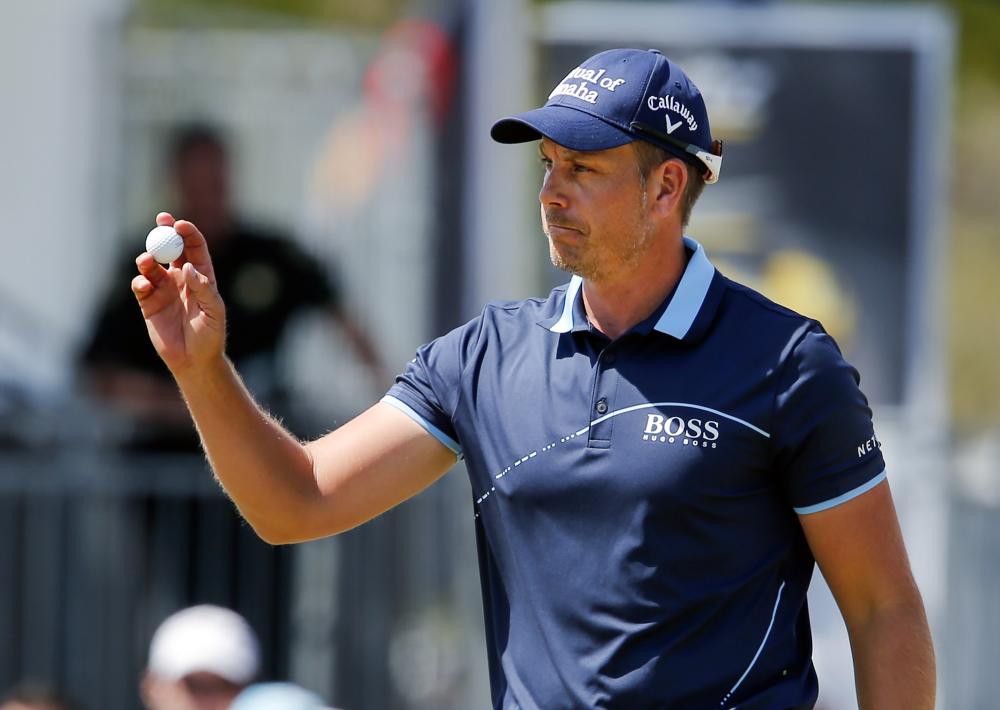 Henrik Stenson reacts to the applause from the gallery on the ninth hole during the second round of the Arnold Palmer Invitational Golf Tournament at Bay Hill Club & Lodge in Orlando Friday. — Reuters
