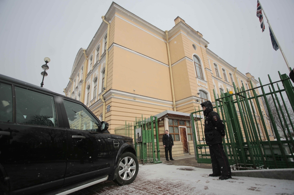 A car drives through a checkpoint outside the British consulate general in St. Petersburg, Russia on Saturday. — Reuters