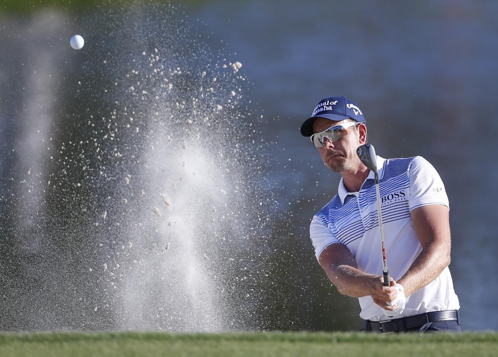 Henrik Stenson plays from the bunker on the 17th hole during the third round of the Arnold Palmer Invitational Golf Tournament at Bay Hill Club & Lodge in Orando Saturday. — Reuters