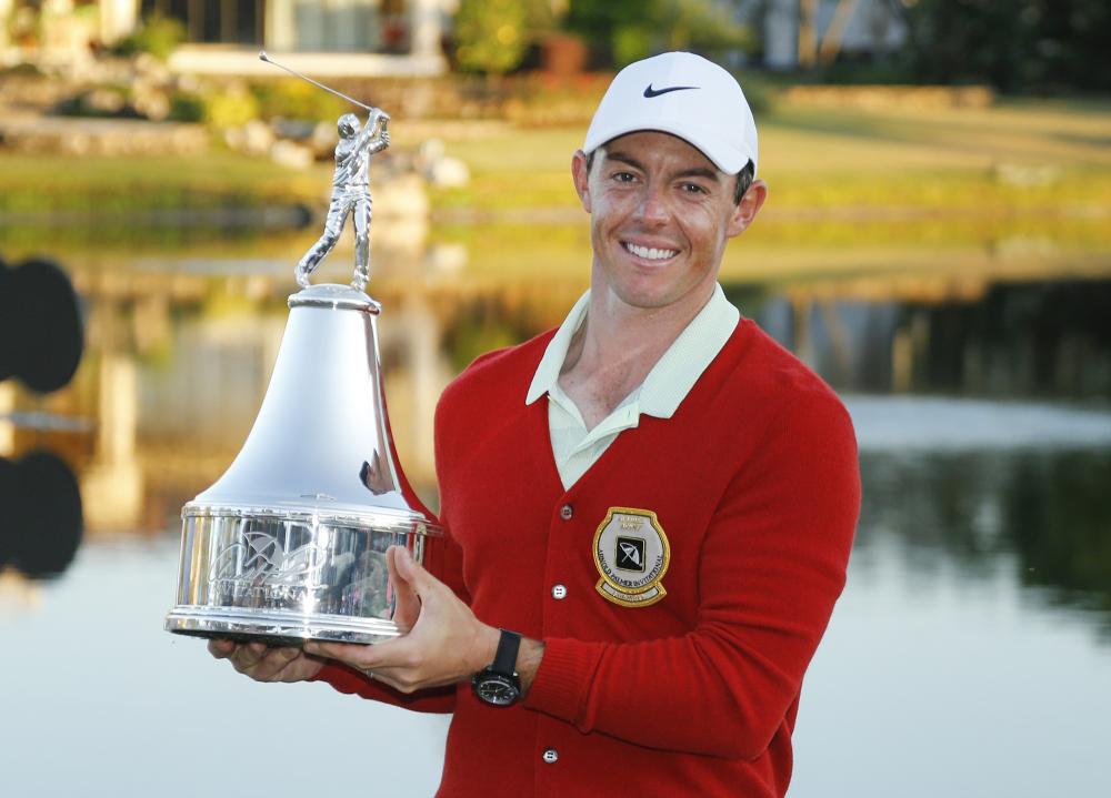 Rory Mcllroy holds the championship trophy after winning the Arnold Palmer Invitational Golf Tournament at Bay Hill Club & Lodge in Orlando Sunday. — Reuters 