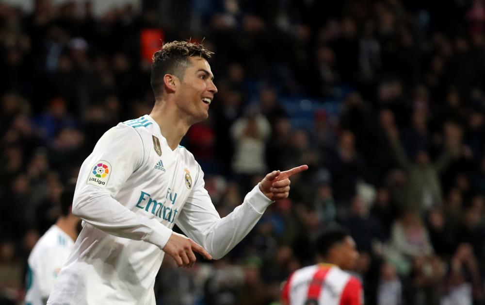 Real Madrid’s Cristiano Ronaldo celebrates scoring against Girona during their Spanish football league match at Santiago Bernabeu, Madrid, Sunday. — Reuters