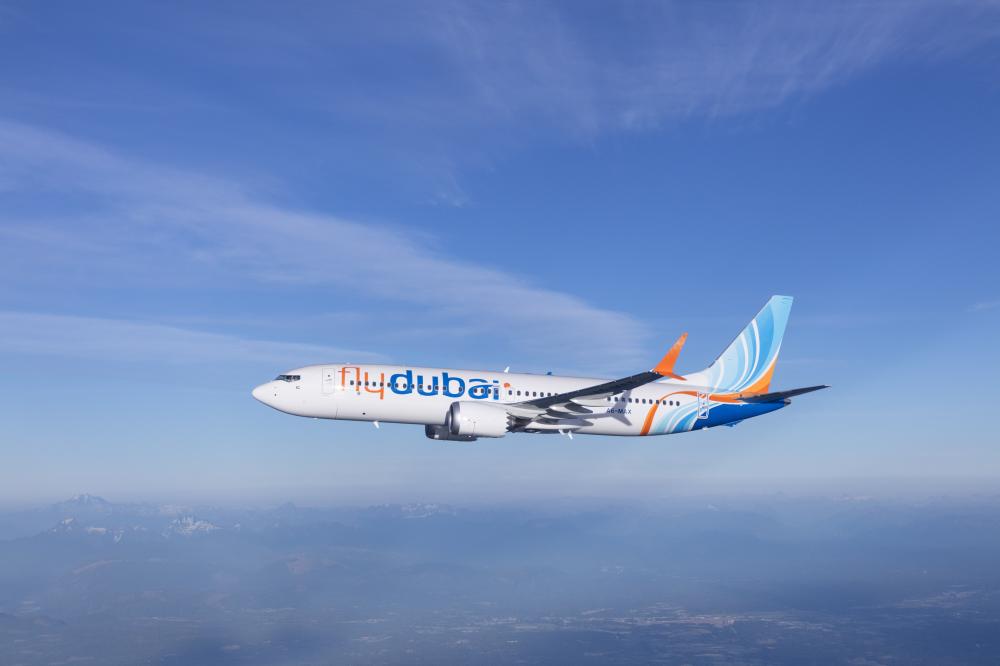 Flydubai Boeing 737 MAX 8 photographed on July 26, 2017 from Wolfe Air Aviation’s Learjet 25B.