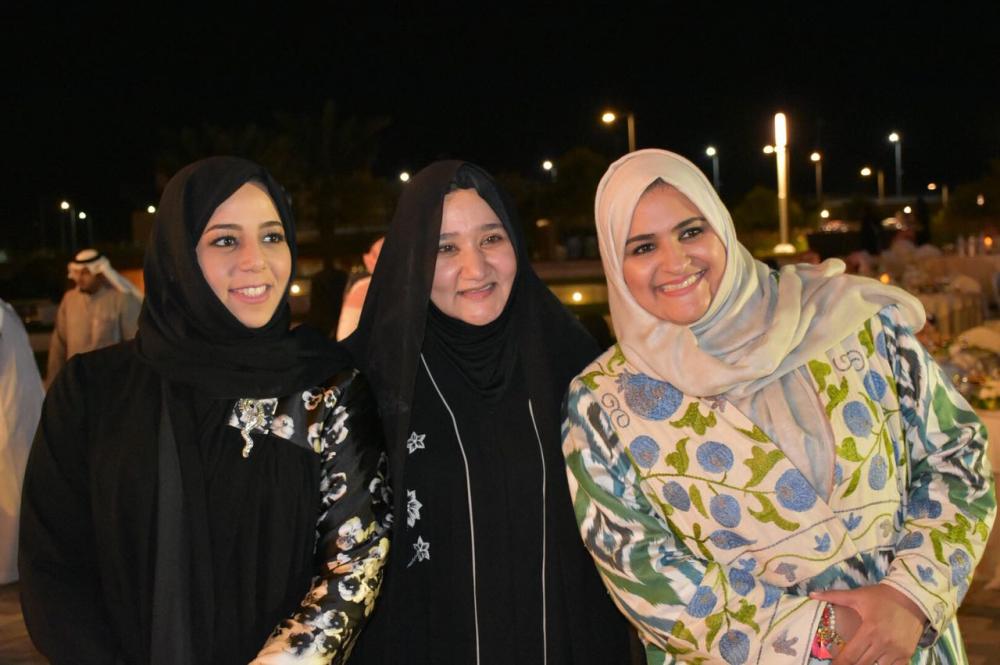 Dr. Suhair Al-Qurashi (C) poses with Thuraya Batterjee (R) and another Dar-Al Hekma student during the award ceremony.