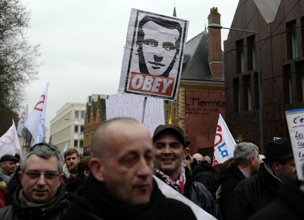 Demonstrators march in Lille, northern France, Thursday. France's trains, flights, schools and other public services are set to be disrupted Thursday by nationwide strikes to protest against President Emmanuel Macron's economic measures. — AP