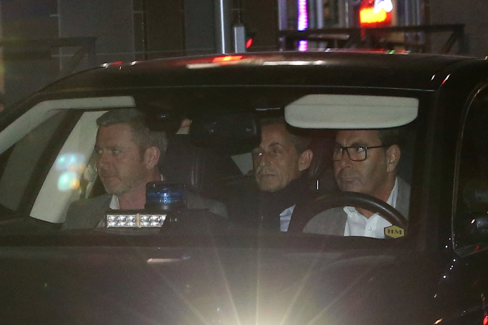 Former French President Nicolas Sarkozy leaves the judiciary police offices in Nanterre, near Paris, France, on Wednesday. — Reuters