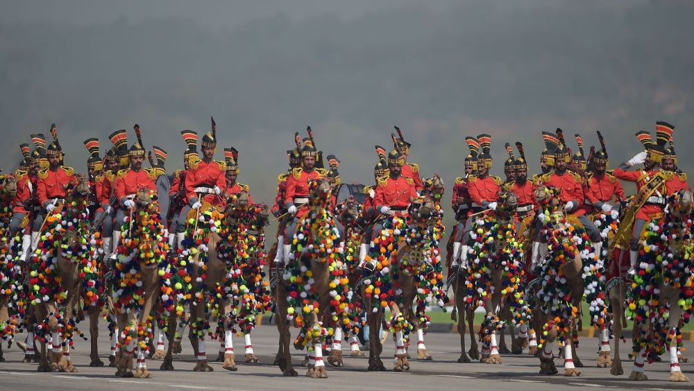 A Pakistani camel-mounted military band performs during a Pakistan Day military parade in Islamabad on Friday. — AFP