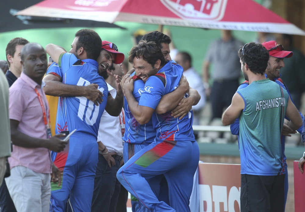 Afghanistan players celebrate after beating Ireland to qualify for the Cricket World Cup after their match at Harare Sports Club, Friday. — AP