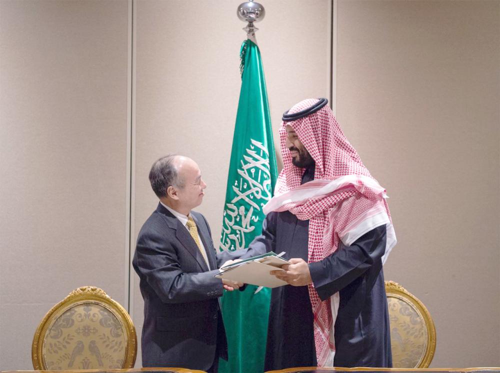 

Crown Prince Muhammad Bin Salman, deputy premier and minister of defense who is also the chairman of the Saudi Public Investment Fund, and SoftBank Group Corp. Chief Executive Masayoshi Son exchange an MoU in New York on Tuesday to establish a solar power project in Saudi Arabia. — Courtesy photo