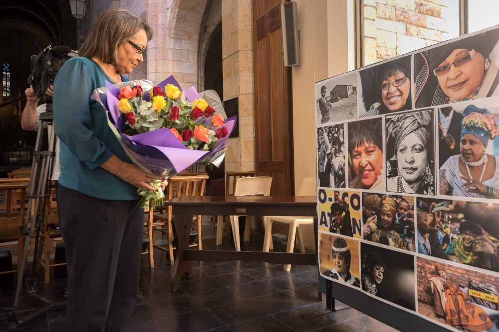 Cape Town mayor Patricia de Lille brings flowers for a memorial at St George's Cathedral for the late South African anti-apartheid campaigner Winnie Madikizela-Mandela, ex-wife of African National Congress (ANC) leader Nelson Mandela, on Tuesday in Cape Town. - AFP
