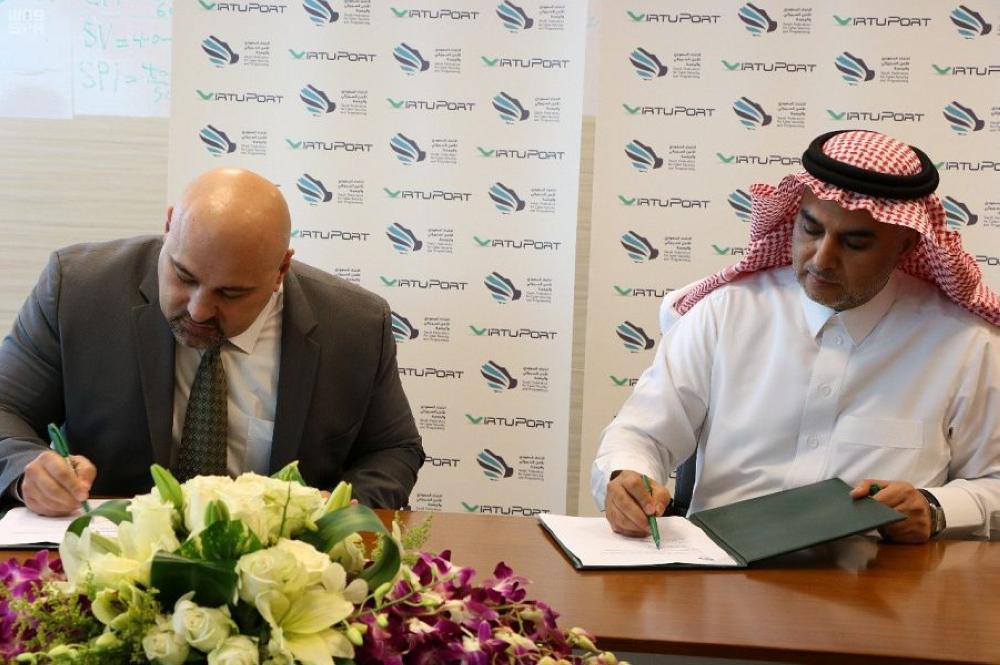 Vice Chairman of the Federation for Cyber Security abd Programing Dr. Abdullah bin Sharaf Al Ghamdi and Virtuport's CEO Samer Omar sign the agreement