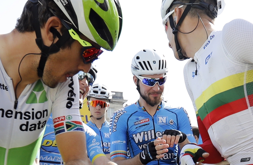 Picture released Monday of Veranda's Willems team rider Michael Goolaerts of Belgium (center rear, orange glasses) at the start of the 116th Paris Roubaix cycling race in Compiegne, France. Goolaerts died Sunday after a crash and cardiac arrest he suffered in the race. He was airlifted to a hospital where he later died.  — EPA