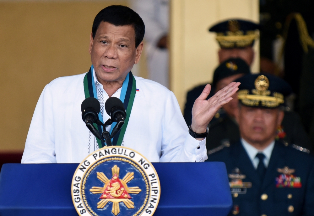 Philippine President Rodrigo Duterte gestures during the change of command ceremony of the Armed Forces of the Philippines (AFP) at Camp Aguinaldo in Quezon City, Metro Manila, Philippines, on Wednesday. — Reuters
