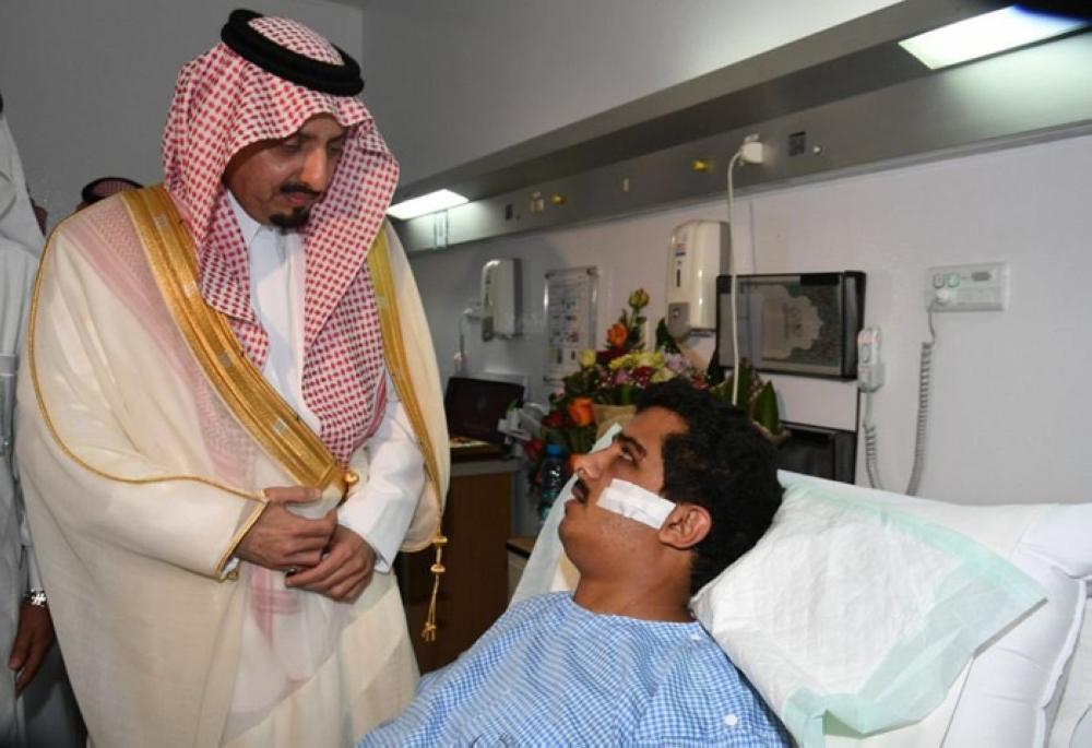 Prince Faisal Bin Khalid, emir of Asir, visits the injured security official Sultan Al-Shihri at Al-Namas General Hospital on Friday. — SPA